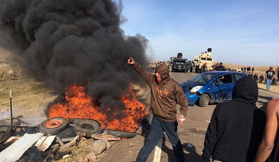natives burning tires and vandalizing stuff